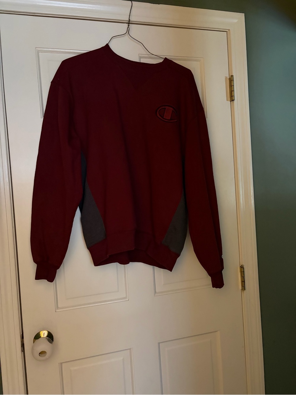 Men’s like new L thick champion, dark burgundy sweatshirt with grey on the side